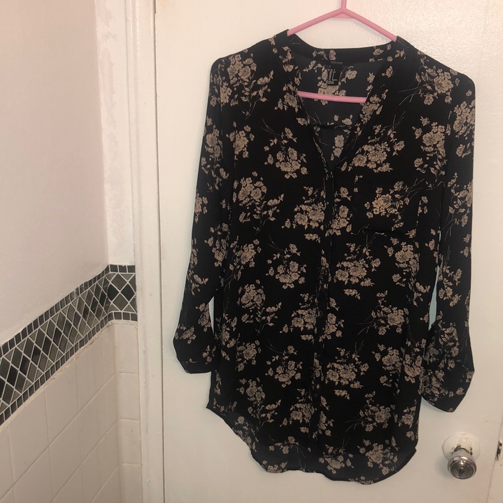 Black button down shirt with beige floral print